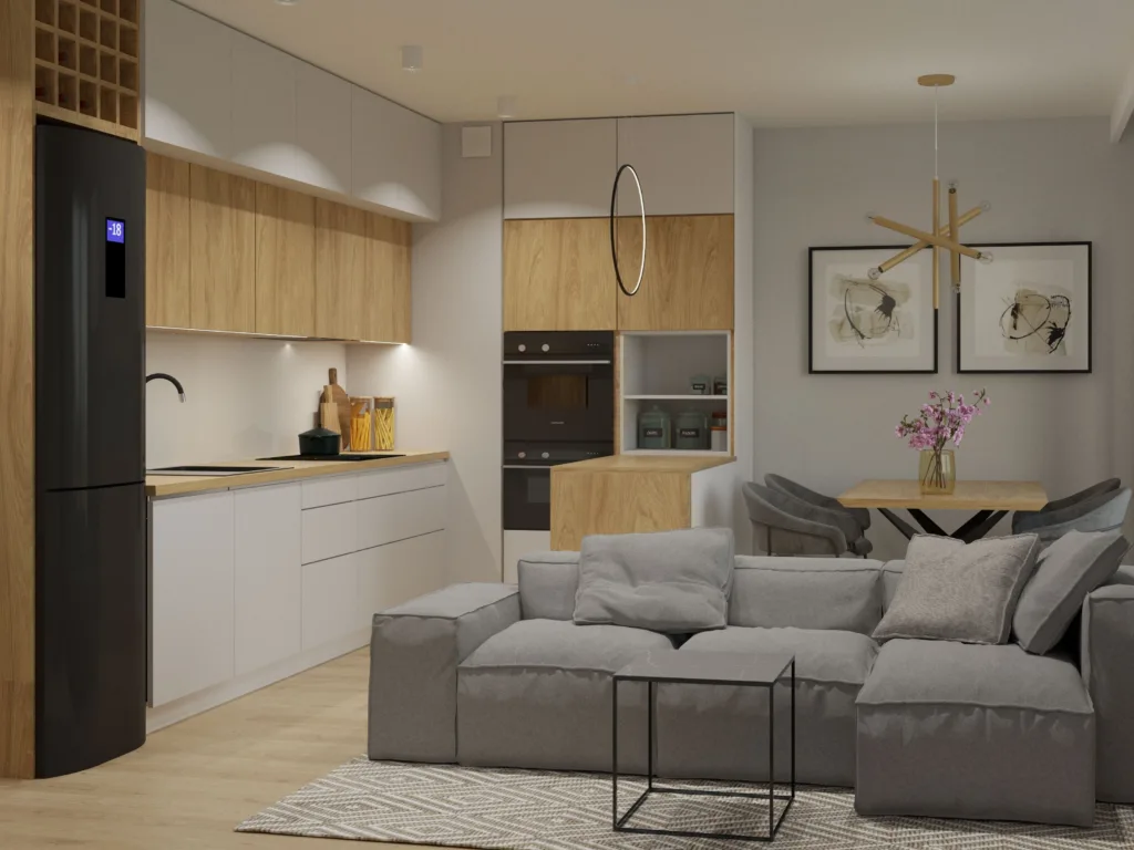 Nowoczesny salon z aneksem kuchennym w stylu skandynawskim. Biało-drewniana zabudowa, czarna lodówka i szary narożnik modułowy – projekt architekta wnętrz Łódź